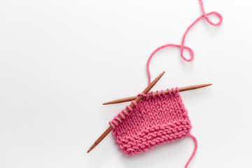 Incomplete knitting project with wooden needles