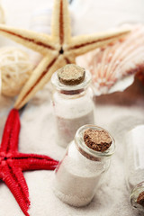 Beautiful seashells on sand background