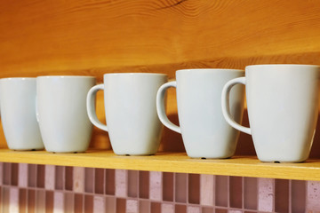 Clean cups are on the shelf