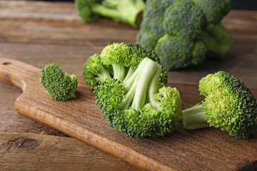 Fresh broccoli on wooden table close up