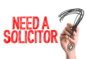 Hand with marker writing: Need a Solicitor?