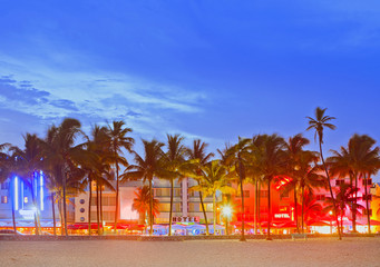 Miami Beach Florida, sunset over illuminated skyline of hotels and restaurants in art deco atyle - 91522061