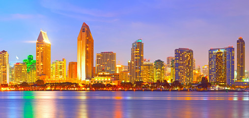 San Diego California, city skyline at sunset on a beautiful summer night with lighted skyscrapers and downtown buildings - 91523238