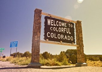 Colorado USA, Welcome sign on the state border, Instagram filter destaurated processing for vintage...