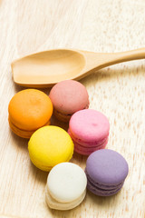 Macarons buttercream on the old  wood.