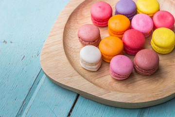 Macarons buttercream on the old  wood.
