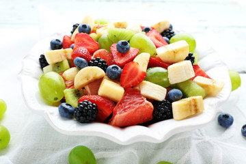 Fresh fruit salad on wooden table