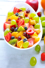 Fresh fruit salad on wooden table