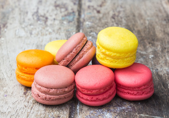 Macarons buttercream on the old  wood.