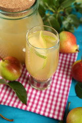 Fresh pear juice with fruit on table close up