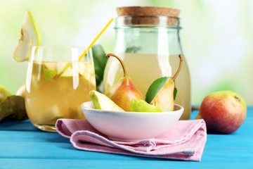 Fresh pear juice with fruit on bright background