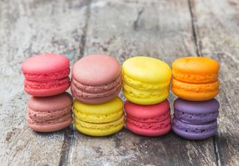 Macarons buttercream on the old  wood.