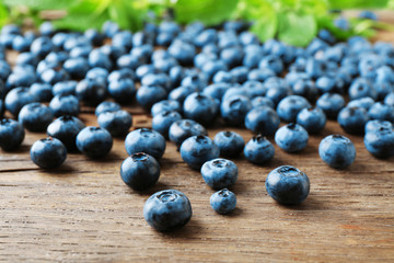 Fresh blueberries on wooden table, closeup
