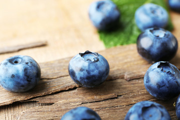 Fresh blueberries on wooden table, closeup