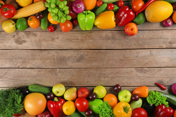 Frame of fresh vegetables on wooden background
