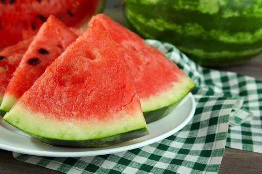 Slices of ripe watermelon on table close up