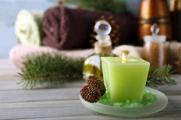 Spa treatments with pine essential oils on wooden background