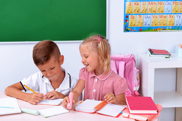 Little boy and girl in the classroom