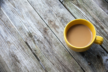 Yellow Coffee Mug on a rustic wooden table - Powered by Adobe