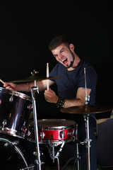Drummer on dark background