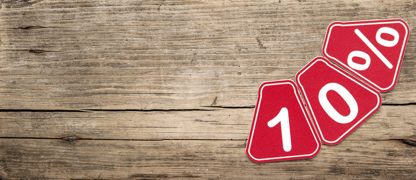 ten percent off discount - price tag on rustic old wooden backgr - Powered by Adobe