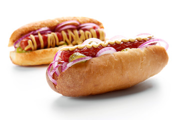 A pair of fresh hot dogs isolated on white