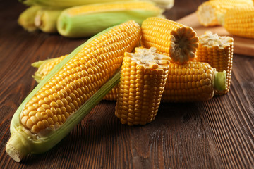 Ripe corn on wooden background