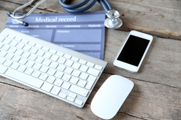 Medical still life with keyboard on wooden table