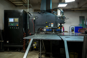 Production workshop. Machine for punching metal