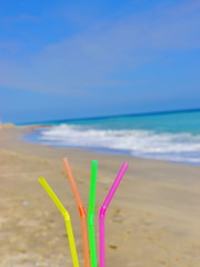 Fototapeta na wymiar straw beach drink