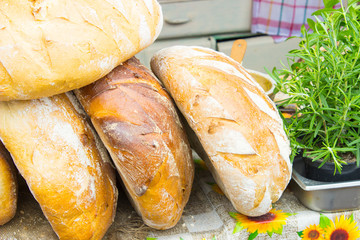 Freshly baked traditional loaves of rye bread on stall