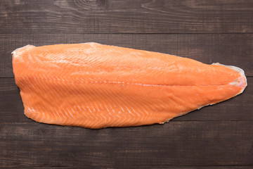 Fresh salmon on the wooden table. Top view