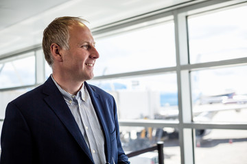 Fototapeta premium Businessman happy to travel by plane