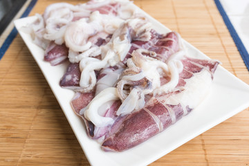 Fresh squid on a dish on the table