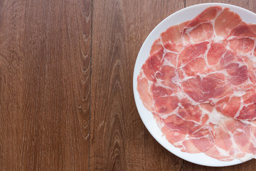 Slide raw meat on the table. Top view