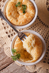 Cheese souffle in a ramekins close-up. vertical view from above
