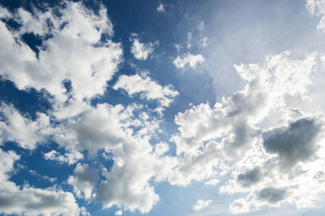 Naklejka na ściany i meble blue sky with clouds closeup and sun light