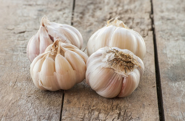Garlic on the wooden background close up