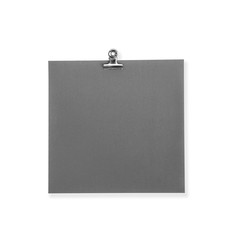 Black paper note and metal paper cilp isolated on white background