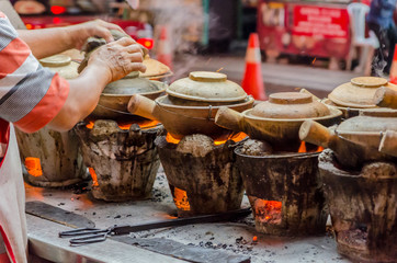 Street Food preparation with clay pots in Kuala Lumpur, Malaysia - obrazy, fototapety, plakaty