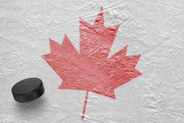 Hockey puck and maple leaf
