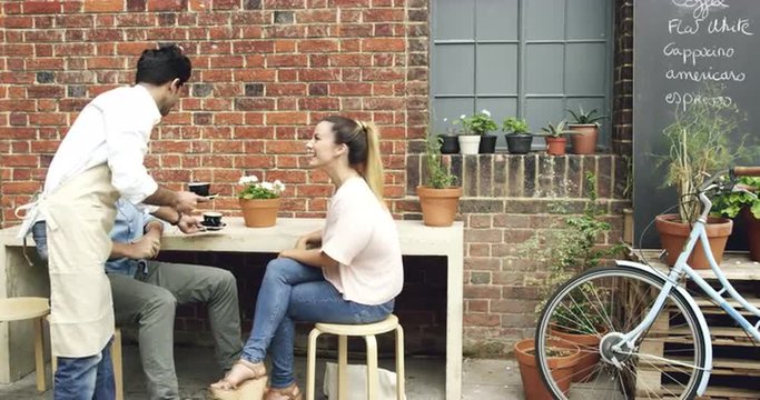Couple dating drinking coffee in cafe