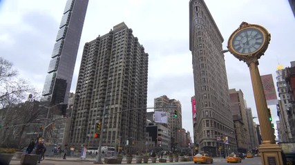 Traffic passing in front of New York's iconic Flatiron Building.