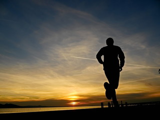 silhouette of a jogger in sunrise