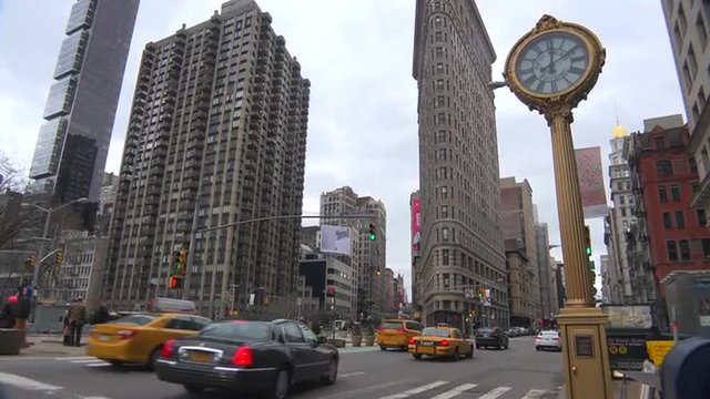 Traffic passing in front of New York's iconic Flatiron Building.