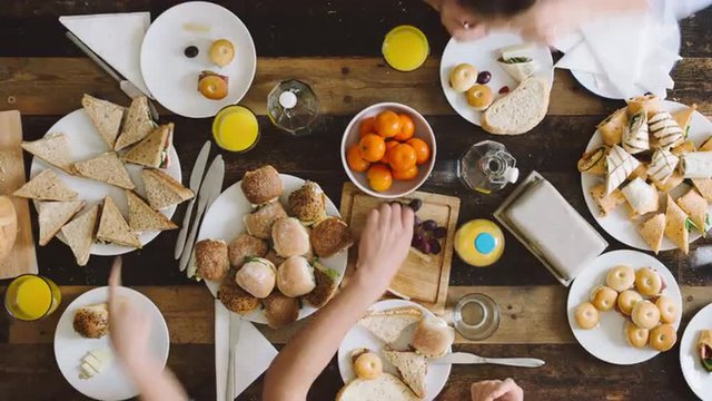 Timelapse mixed group of people eating lunch aerial view organic food togetherness concept
