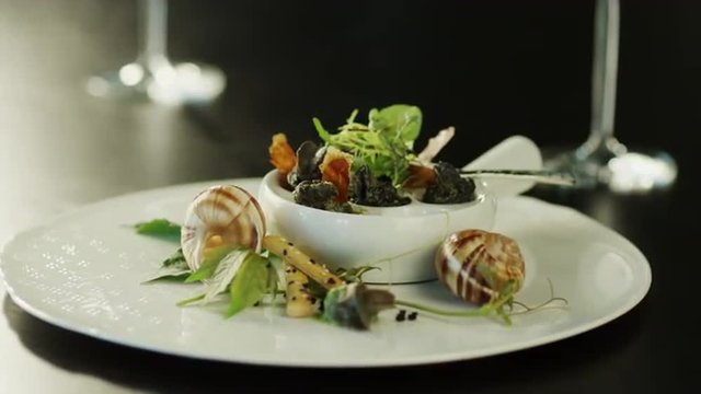Serving Delicious Baked Escargots in Luxury Restaurant.
