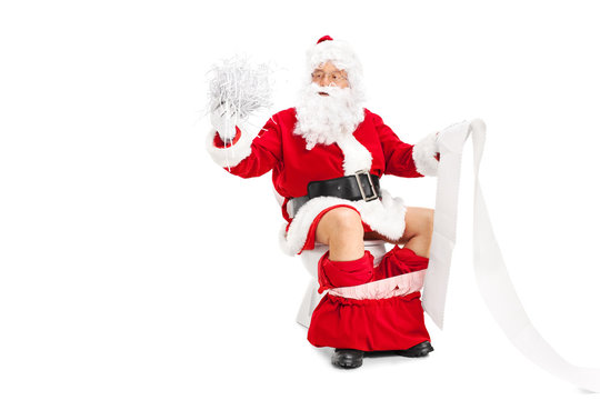 Santa Claus holding a pile of shredded paper