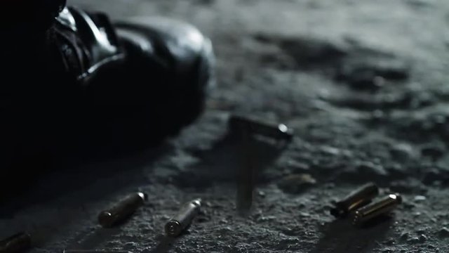 Close Up shot of Bullet Shells are Falling Down to Ground near Special Forces.