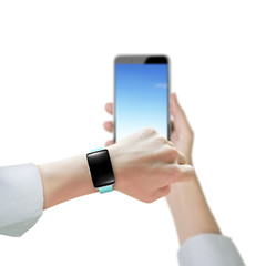 Woman hand wearing smart watch and holding smart phone